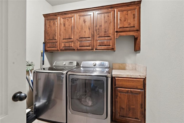 6401 S 42nd St, Rogers, AR 72758 - laundry area featuring cabinet space and washer and clothes dryer