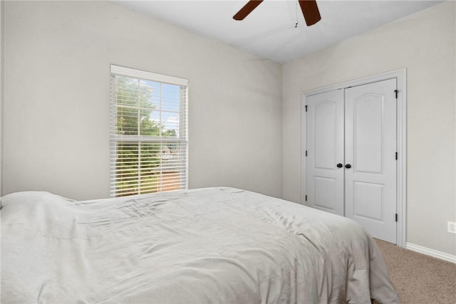 6401 S 42nd St, Rogers, AR 72758 - carpeted bedroom featuring a closet, baseboards, and ceiling fan
