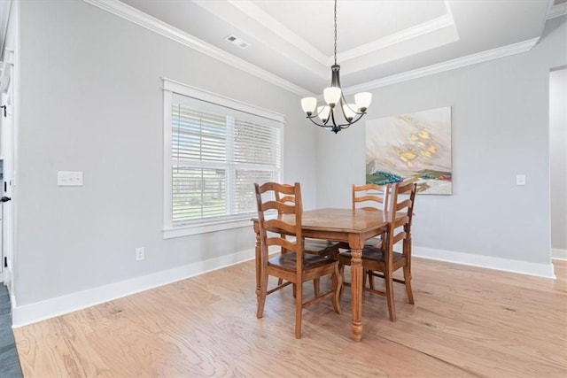 1265 Cassia, Tontitown, AR 72762 - dining area with a chandelier, light wood-style floors, crown molding, baseboards, and a tray ceiling