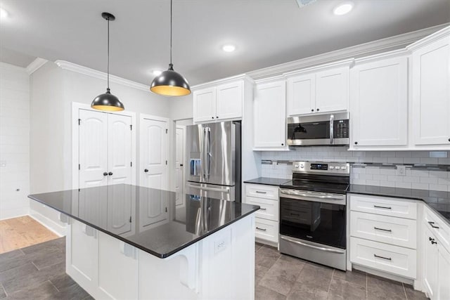 1265 Cassia, Tontitown, AR 72762 - kitchen featuring stainless steel appliances, crown molding, dark countertops, white cabinetry, and decorative backsplash