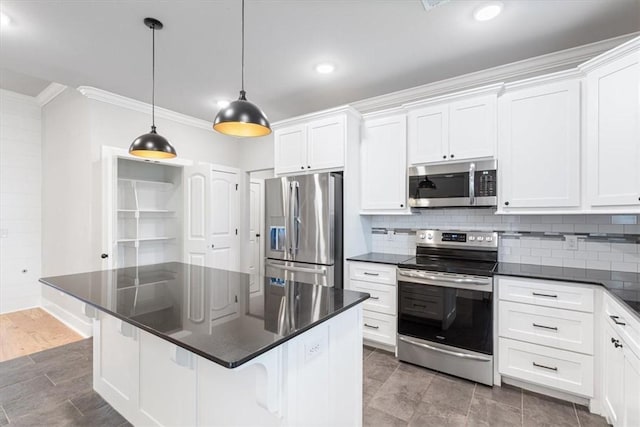 1265 Cassia, Tontitown, AR 72762 - kitchen featuring stainless steel appliances, crown molding, dark countertops, tasteful backsplash, and white cabinets