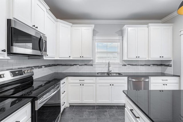 1265 Cassia, Tontitown, AR 72762 - kitchen with appliances with stainless steel finishes, a sink, white cabinets, backsplash, and crown molding
