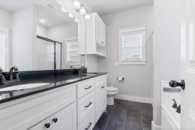 1265 Cassia, Tontitown, AR 72762 - bathroom with a shower stall, double vanity, plenty of natural light, and toilet