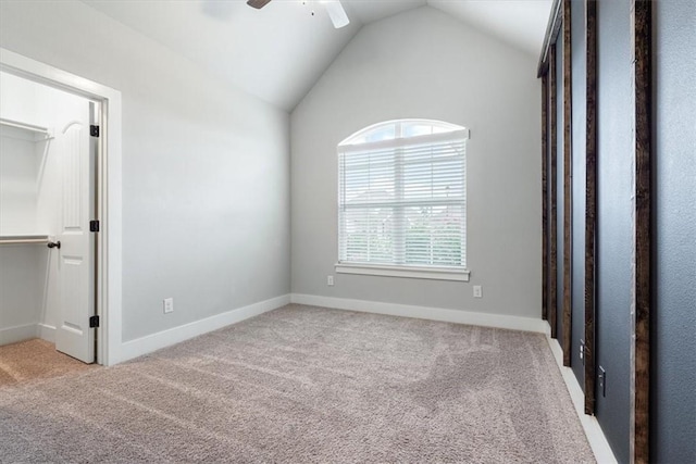 1265 Cassia, Tontitown, AR 72762 - unfurnished bedroom featuring carpet flooring, lofted ceiling, a spacious closet, baseboards, and ceiling fan