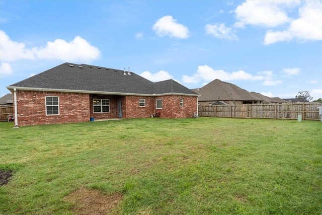 1265 Cassia, Tontitown, AR 72762 - rear view of house with brick siding and a shingled roof