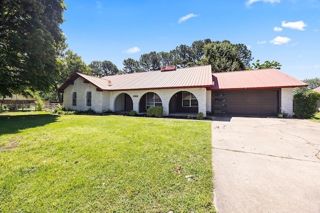1149 Sunrise Ave, Springdale, AR 72764 - single story home with a garage, concrete driveway, a chimney, and metal roof