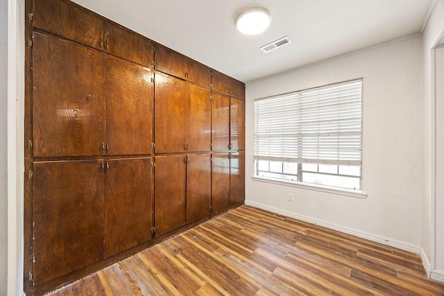 1149 Sunrise Ave, Springdale, AR 72764 - unfurnished bedroom featuring wood finished floors, baseboards, a closet, and crown molding