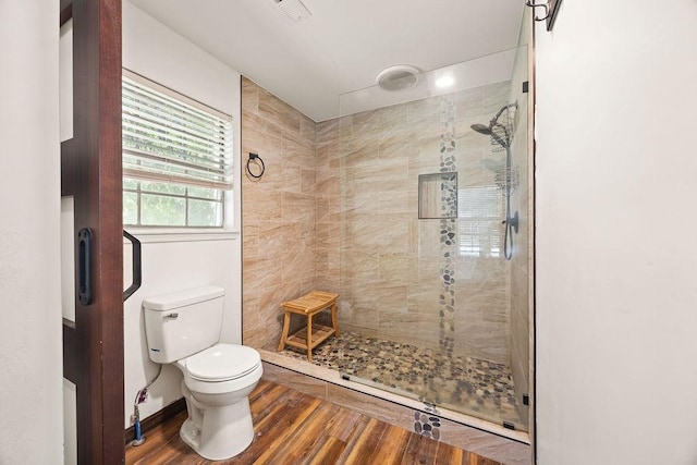 1149 Sunrise Ave, Springdale, AR 72764 - full bath with tiled shower, toilet, and wood finished floors