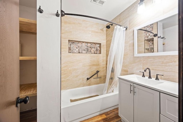 1149 Sunrise Ave, Springdale, AR 72764 - full bathroom featuring shower / bath combo, vanity, tile walls, and wood finished floors