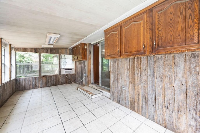 1149 Sunrise Ave, Springdale, AR 72764 - unfurnished sunroom with wood walls, tile patterned flooring, and cooling unit