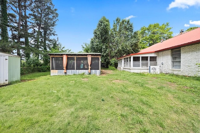 1149 Sunrise Ave, Springdale, AR 72764 - view of grassy yard with a sunroom and ac unit