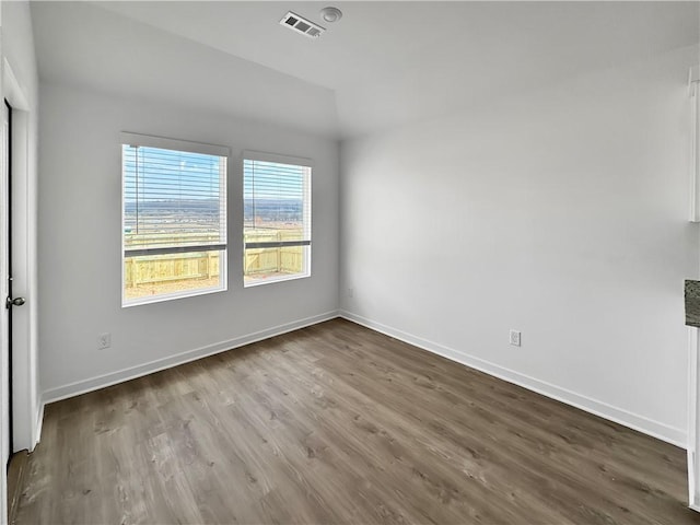 208 Greer St, Pea Ridge, AR 72751 - spare room featuring wood finished floors and baseboards
