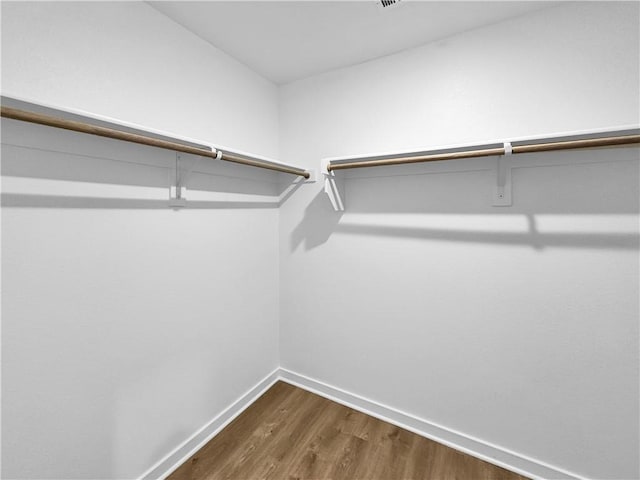 208 Greer St, Pea Ridge, AR 72751 - spacious closet featuring dark wood-style flooring