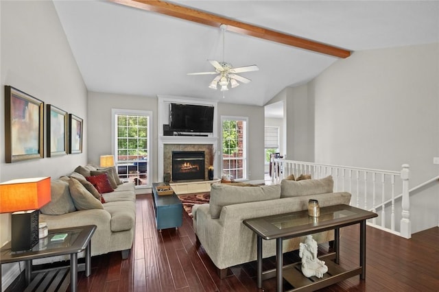 8200 Titleist Cir, Rogers, AR 72756 - living room featuring dark wood-type flooring, ceiling fan, a stone fireplace, and baseboards