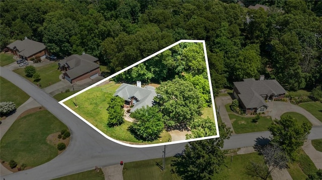8200 Titleist Cir, Rogers, AR 72756 - aerial view of property's location with property parcel outlined and a heavily wooded area