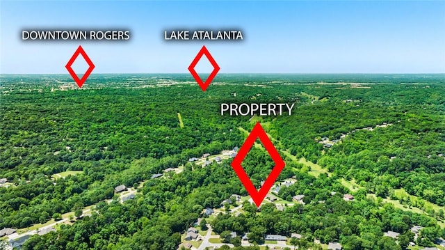 8200 Titleist Cir, Rogers, AR 72756 - exterior view of a heavily wooded area
