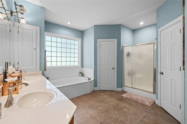 8200 Titleist Cir, Rogers, AR 72756 - full bathroom with a stall shower, a garden tub, double vanity, and tile patterned flooring