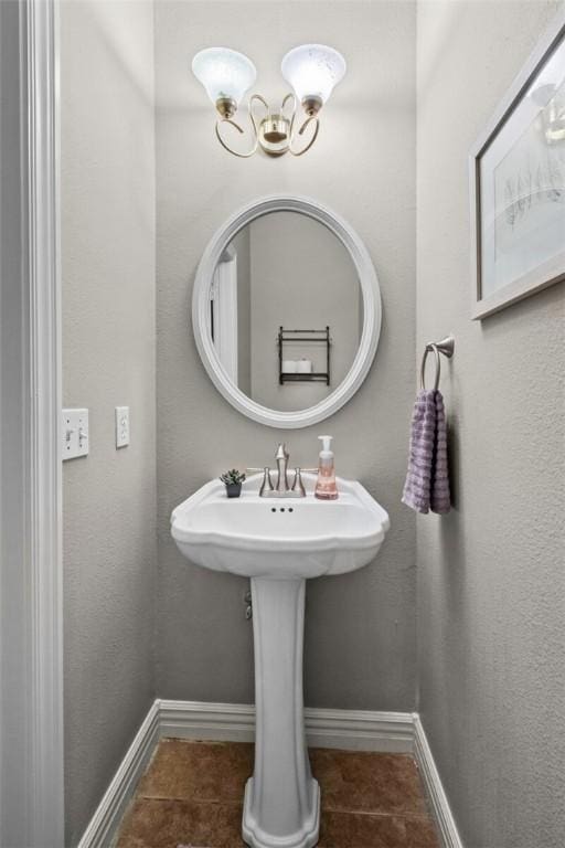 8200 Titleist Cir, Rogers, AR 72756 - bathroom with tile patterned flooring, baseboards, and a chandelier