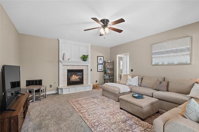 8200 Titleist Cir, Rogers, AR 72756 - carpeted living area with a ceiling fan, a tile fireplace, and baseboards