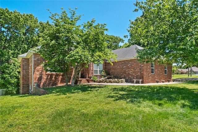 8200 Titleist Cir, Rogers, AR 72756 - view of front of home with a front lawn and brick siding