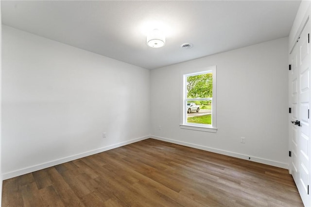 5479 Bob Mills Rd, Springdale, AR 72762 - empty room with wood finished floors and baseboards