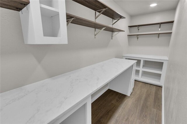 1115 Eicher Ave, Springdale, AR 72764 - walk in closet with dark wood-style flooring