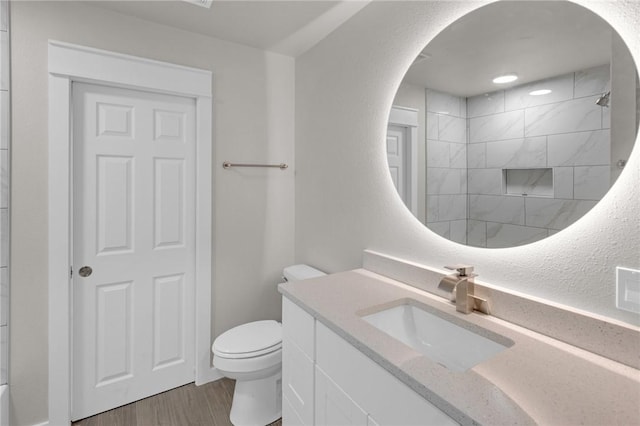 1115 Eicher Ave, Springdale, AR 72764 - bathroom with toilet, vanity, wood finished floors, and a shower