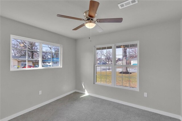 1115 Eicher Ave, Springdale, AR 72764 - spare room featuring healthy amount of natural light, baseboards, ceiling fan, and carpet