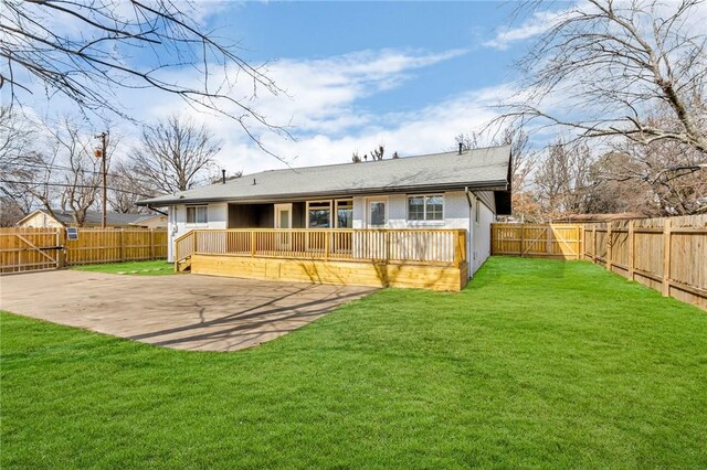 1115 Eicher Ave, Springdale, AR 72764 - back of property with a deck and a patio area