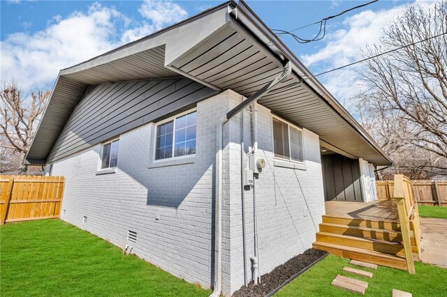 1115 Eicher Ave, Springdale, AR 72764 - view of property exterior featuring brick siding and a wooden deck