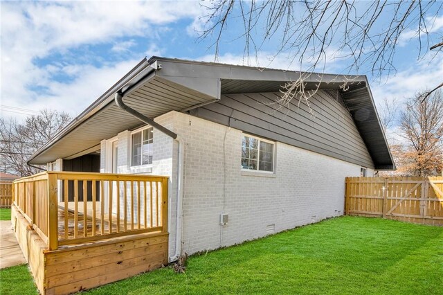 1115 Eicher Ave, Springdale, AR 72764 - view of side of property featuring brick siding, crawl space, and a deck