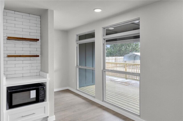 1115 Eicher Ave, Springdale, AR 72764 - doorway to outside featuring light wood-style flooring, baseboards, and recessed lighting