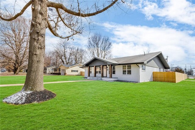 1115 Eicher Ave, Springdale, AR 72764 - single story home featuring a porch, a front yard, and brick siding