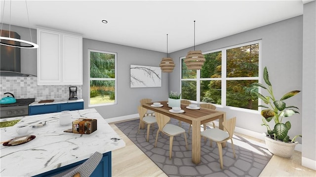 13 Abbotsley Ln, Bella Vista, AR 72714 - dining space with baseboards and wood finished floors