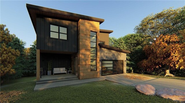 13 Abbotsley Ln, Bella Vista, AR 72714 - rear view of property with driveway, a lawn, and board and batten siding