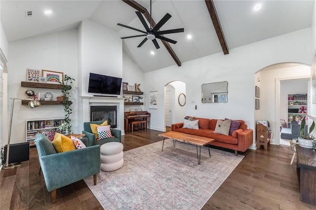 7533 Devonshire Ave, Springdale, AR 72762 - living area featuring arched walkways, ceiling fan, high vaulted ceiling, a glass covered fireplace, and wood finished floors