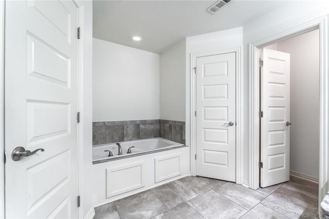 7533 Devonshire Ave, Springdale, AR 72762 - bathroom with a bath and tile patterned flooring