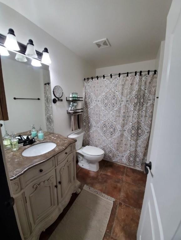 3 Rhonda Ln, Bella Vista, AR 72715 - full bathroom with vanity, tile patterned floors, and toilet