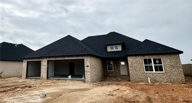 841 Bellagiola Ave, Tontitown, AR 72762 - view of front of house with brick siding, a garage, and a shingled roof