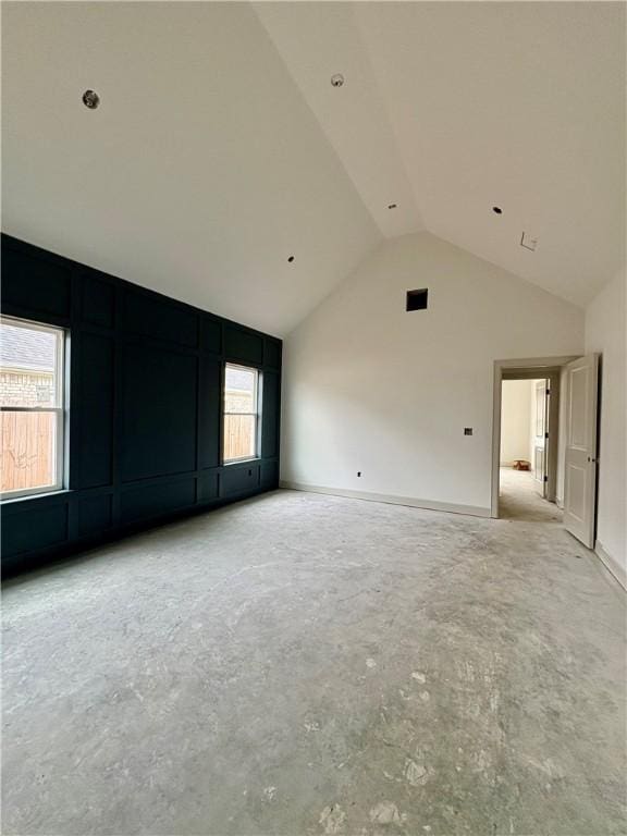 841 Bellagiola Ave, Tontitown, AR 72762 - unfurnished room featuring concrete flooring and high vaulted ceiling