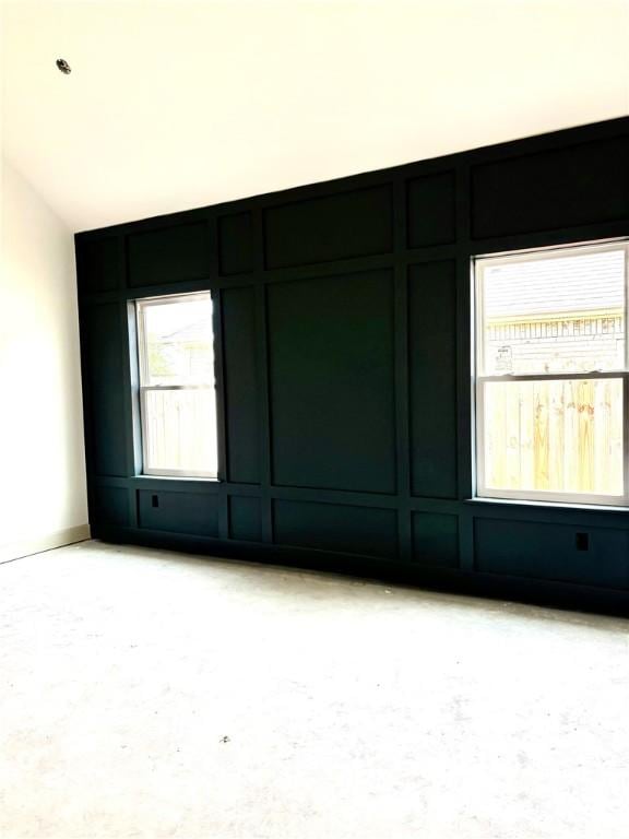 841 Bellagiola Ave, Tontitown, AR 72762 - spare room featuring lofted ceiling
