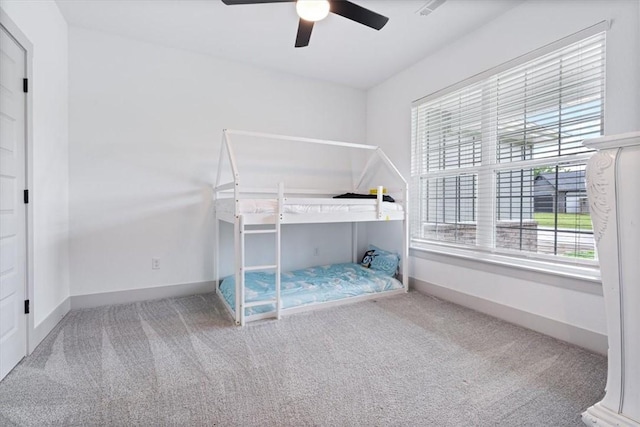 12 Lockhart Dr, Bella Vista, AR 72715 - unfurnished bedroom with carpet flooring, baseboards, and ceiling fan