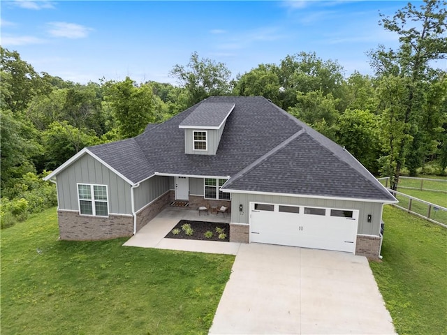 12 Lockhart Dr, Bella Vista, AR 72715 - view of front of home featuring brick siding, a shingled roof, board and batten siding, a garage, and concrete driveway