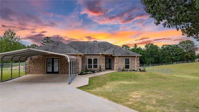 8001 Mars Hill Rd, Ar, AR 72011 - view of front of property featuring french doors, brick siding, driveway, a carport, and a shingled roof