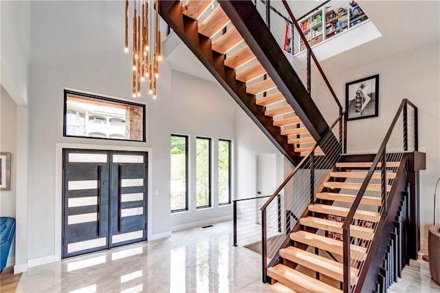 675 N Cliffside Dr, Fayetteville, AR 72701 - entrance foyer with a towering ceiling, stairway, and marble tiled floors