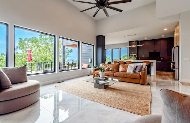 675 N Cliffside Dr, Fayetteville, AR 72701 - living area featuring a ceiling fan, light marble finish floors, recessed lighting, and a towering ceiling