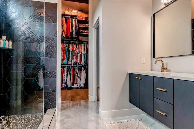 675 N Cliffside Dr, Fayetteville, AR 72701 - bathroom featuring vanity, a stall shower, and a spacious closet