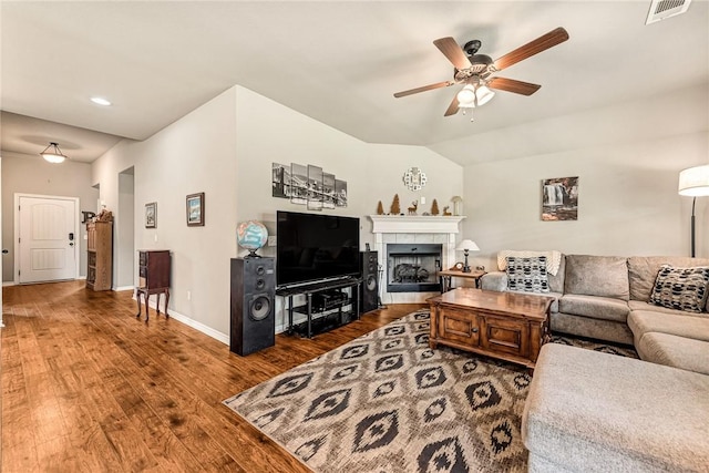 811 SW Pure Globe St, Bentonville, AR 72712 - living room with a ceiling fan, wood finished floors, baseboards, recessed lighting, and a tile fireplace