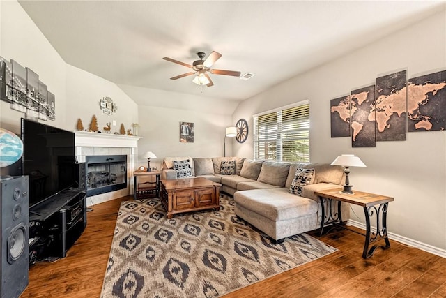 811 SW Pure Globe St, Bentonville, AR 72712 - living area with a ceiling fan, wood finished floors, a fireplace, vaulted ceiling, and baseboards