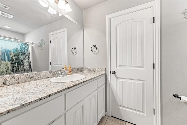811 SW Pure Globe St, Bentonville, AR 72712 - full bathroom with vanity, tile patterned floors, and curtained shower